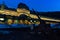 Old train station of Canfranc on a winter night with snow on the tracks, and a switching points in foreground. Huesca, Spain