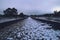 Old train track at Gascones-Buitrago station with some snowflakes.