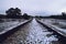 Old train track at Gascones-Buitrago station with some snowflakes.