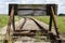 Old train tracks with a wooden stop device. Composition with leading lines.