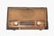 Old transistor Radio is made of wood isolate on white background