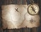 Old treasure pirates` map with compass on wood table. 3d illustration.