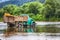 Old truck transports cargo wade across the river