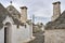 Old trulli houses in Alberobello town in Italy