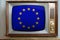 Old tube vintage TV with EU national flag on screen, television eternal values â€‹â€‹concept, global world trade, politics, retro