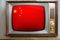 Old tube vintage TV with the national flag of China on the screen, the concept of eternal values â€‹â€‹on television, global world