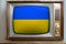 Old tube vintage TV with the national flag of Ukraine on the screen, stylish interior of the 60s, the concept of eternal values