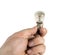 Old tungsten incandescent lamp in hand. Isolated a white background
