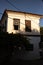 Old Turkish wooden windows in old village house. Vintage. Vertical photo.