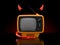 Old TV with devil horns and tail
