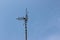 Old TV satellite signal receiver under blue sky