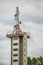 Old TV transmitter tower with modern mobile network and satellite mast with antennas