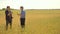 Old two farmers explore are studying. man Wheat Field summer in the field wheat bread. slow motion video. farmer Smart