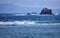 Old two-masted schooner near the rocks in the sea. Indonesia, Ba