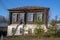 Old two-story house against the bright blue sky