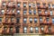 Old typical apartment buildings in Harlem, New York City, USA