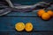 An old, ugly lemon, lying on a blue wooden background