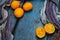 An old, ugly lemon, lying on a blue wooden background