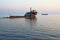 Old unknown abandoned barge in the Black Sea. Kabardinka, Russia