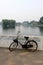 The old unused bike lay on the railing of houhai lake park, Beijing