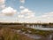 old unused bridge in the distance above estuary stream countryside