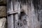 Old unvarnished wooden door weathered by time