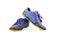 Old used blue worn out futsal sports shoes on white background soccer sportware object isolated