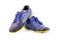 Old used blue worn out futsal sports shoes on white background soccer sportware object isolated