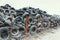 Old used damaged car tires at the dump