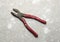 Old used iron cutting pliers tongs