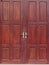 Old used weathered abandoned red brown colour hard wood double door