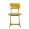 Old used wooden school chair for
