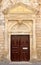 Old venetian door facade in city of Rethymno