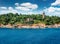 Old Venetian lighthouse in the Fiskardo port. Stunning morning seascape of Ionian Sea, Kefalonia island, village, Greece, Europe.