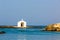 Old venetian lighthouse at harbor in Crete, Greece. Small cretan village Kavros.