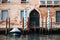 Old Venetian Palazzo With A Parked Boat