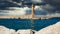 Old Venetian port of Rethymno with a lighthouse and a dramatic sky