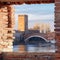 Old Verona town, view through brickwall window