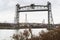 Old Vertical Lift Bridge across a Ship Canal in Autumn