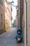 Old Vespa scooter on italian alley