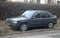Old veteran or youngtimer classic European French classic sedan car Peugeot 309 parked