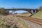 Old viaduct over the railway tracks. Concrete bridge over the railroad