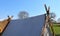 Old vikings tent made of cloth and wood in front of a blue sky