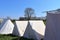 Old vikings tent made of cloth and wood in front of a blue sky