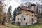 Old villa with broken facade and wooden balconies