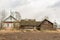 Old village abandoned wooden house And a woodshed, a woodcutter