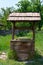 Old village well with a wood roof