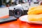 Old Vintage Analogue Camera on the Table with Phone and Youtiao