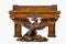 Old vintage antique table heavily carved supported by eagle wings spread