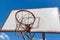 Old and vintage basketball backboard and blue sky with clouds as a background